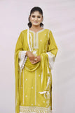 The outfit is a mustard yellow color with white embroidery and lace detailing.